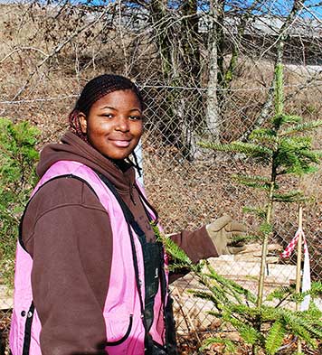 Lavette Lacy, 18, planting at an I-205 this season. (ODOT)